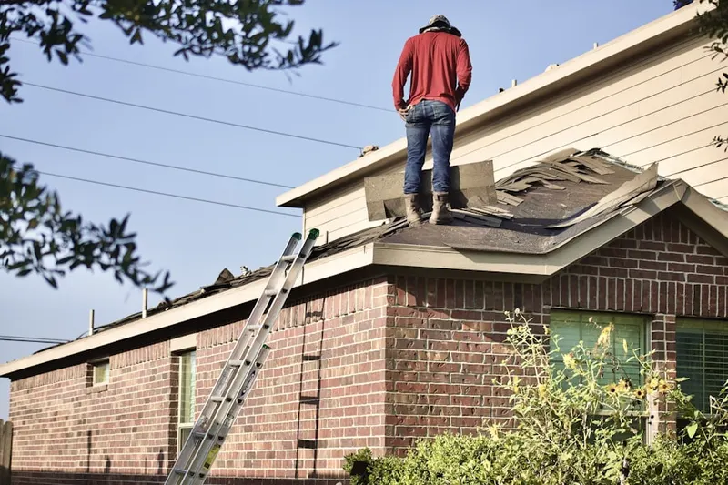 Professional roofer working on a residential roof in Downtown Destin